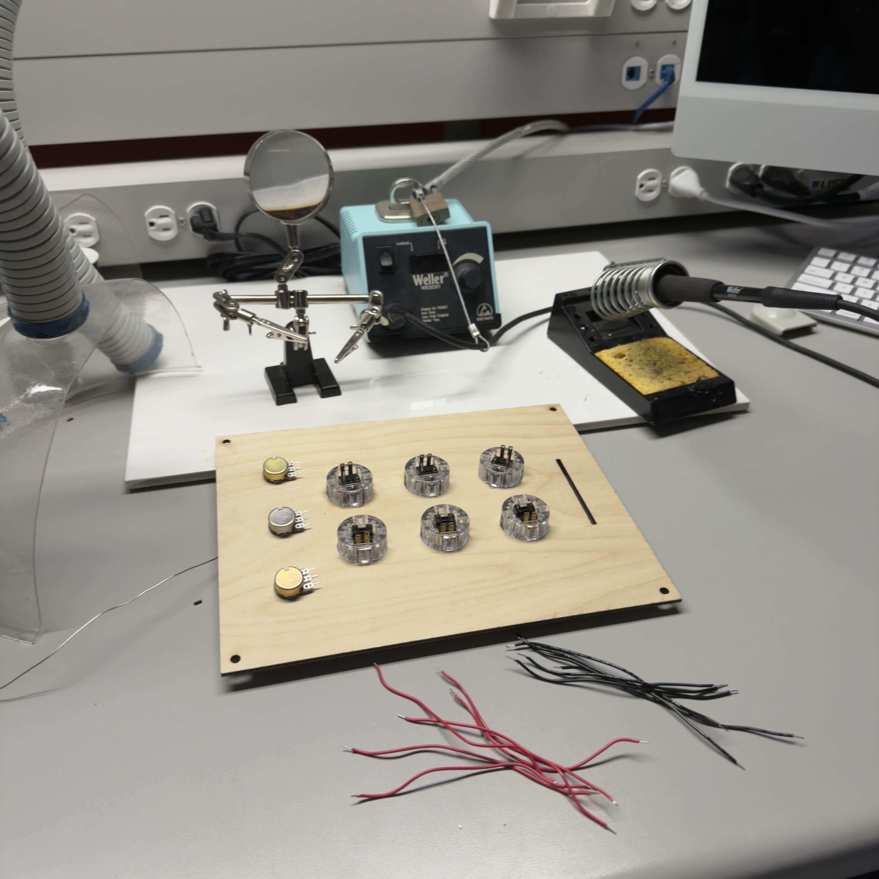Assembly workspace setup. I organized parts and tools and began preparing the controller for wiring and soldering.